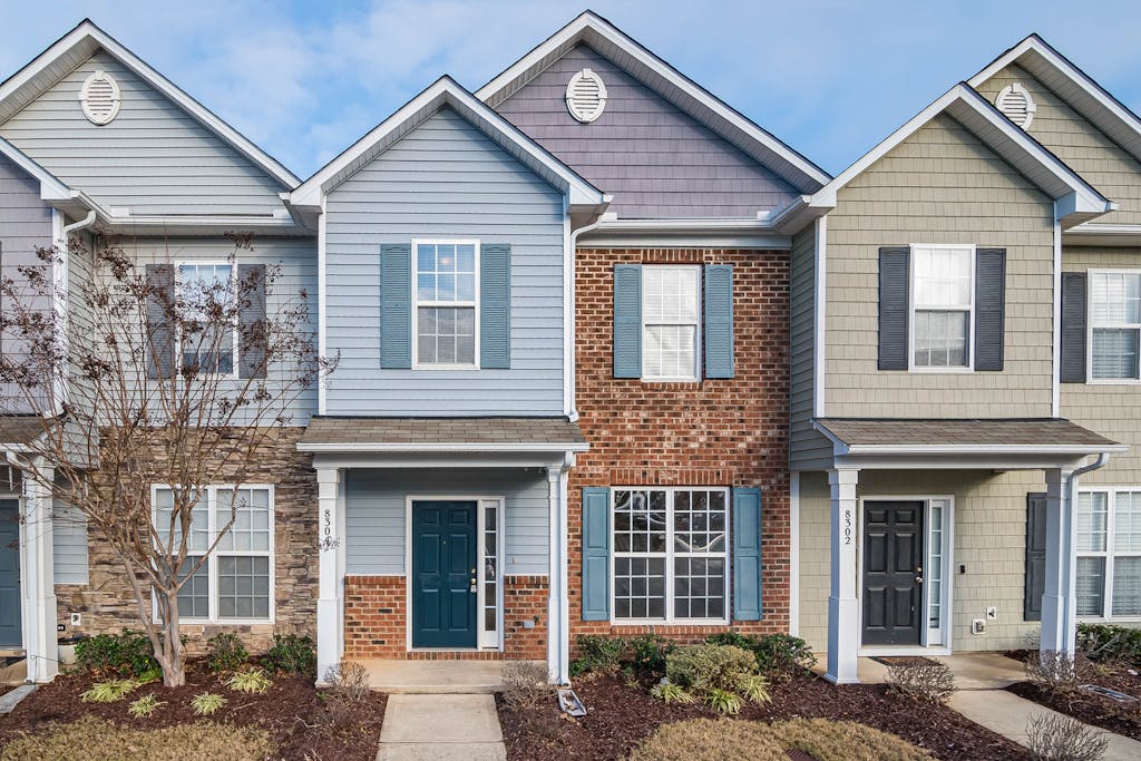 Elegant view of suburban townhouses showcasing diverse architectural styles.